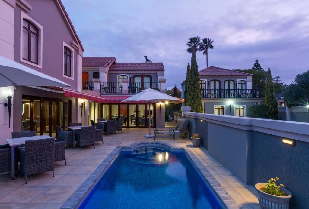 Outdoor swimming pool and terrace at Villa Tuscana